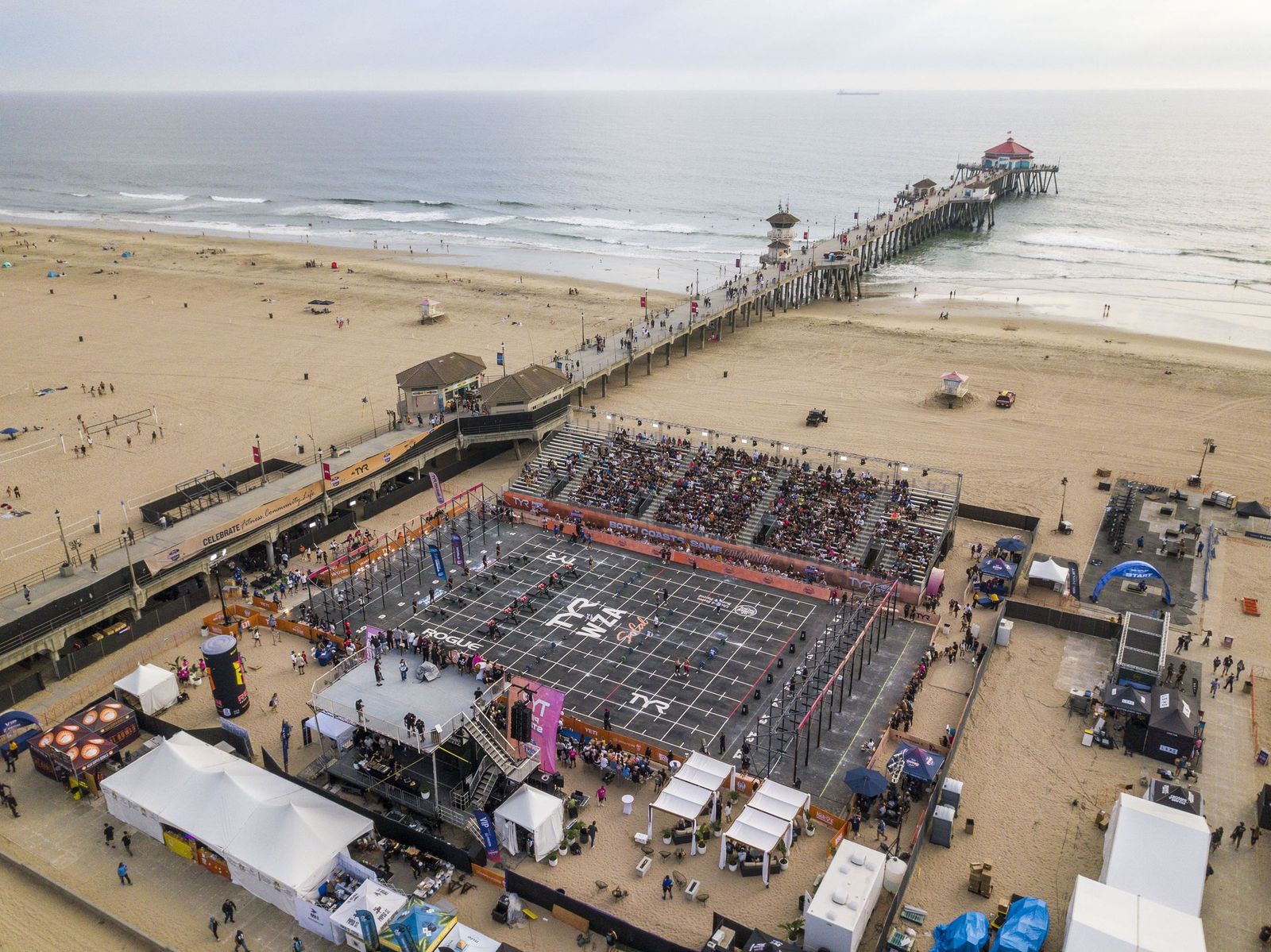The arena, grandstands and vendor village beside the Huntington Beach Pier