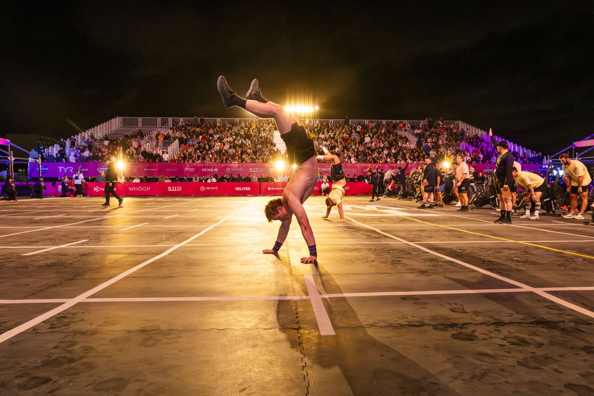 A night crowd in front of a lit stage at Wodapalooza